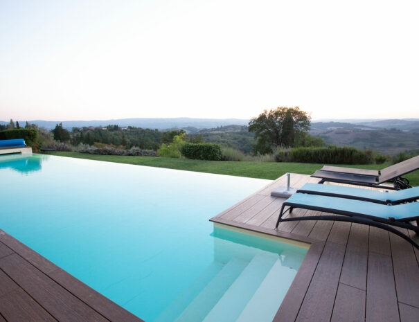 villa bellavista swimming pool deck with lounge chairs at sunset - chianti hills - Timeless Tuscany tour operator