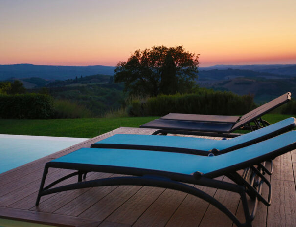 villa bellavista swimming pool sunset lounge chairs - by Timeless Tuscany