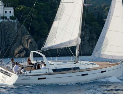 White sailing boat near the Tuscan coast - travel experiences by Timeless Tuscany tour operator