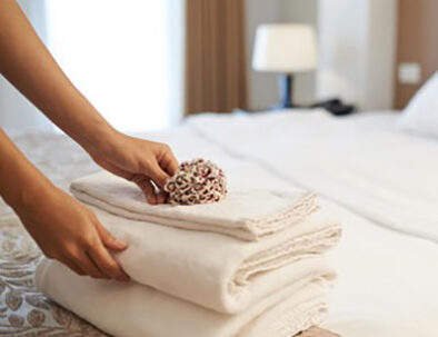 colf placing flowers on clean white towels - travel services by Timeless Tuscany tour operator
