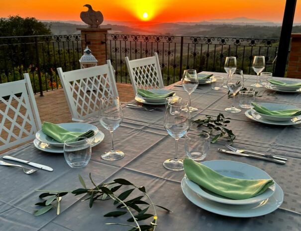 timeless-tuscany-villa-bellavista-terrace-grey-dinner-table-sunset-01